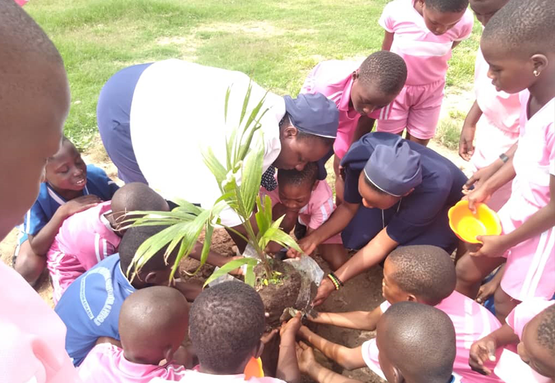 "student tree planting photo"